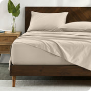 Percale sheets on bed in a modern bedroom