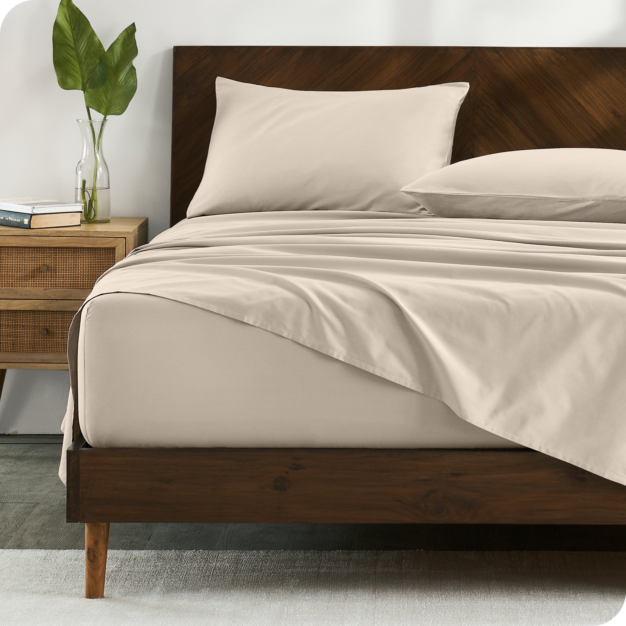 Percale sheets on bed in a modern bedroom