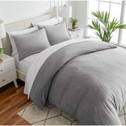 Angled view of bed with a duvet cover folded over on itself