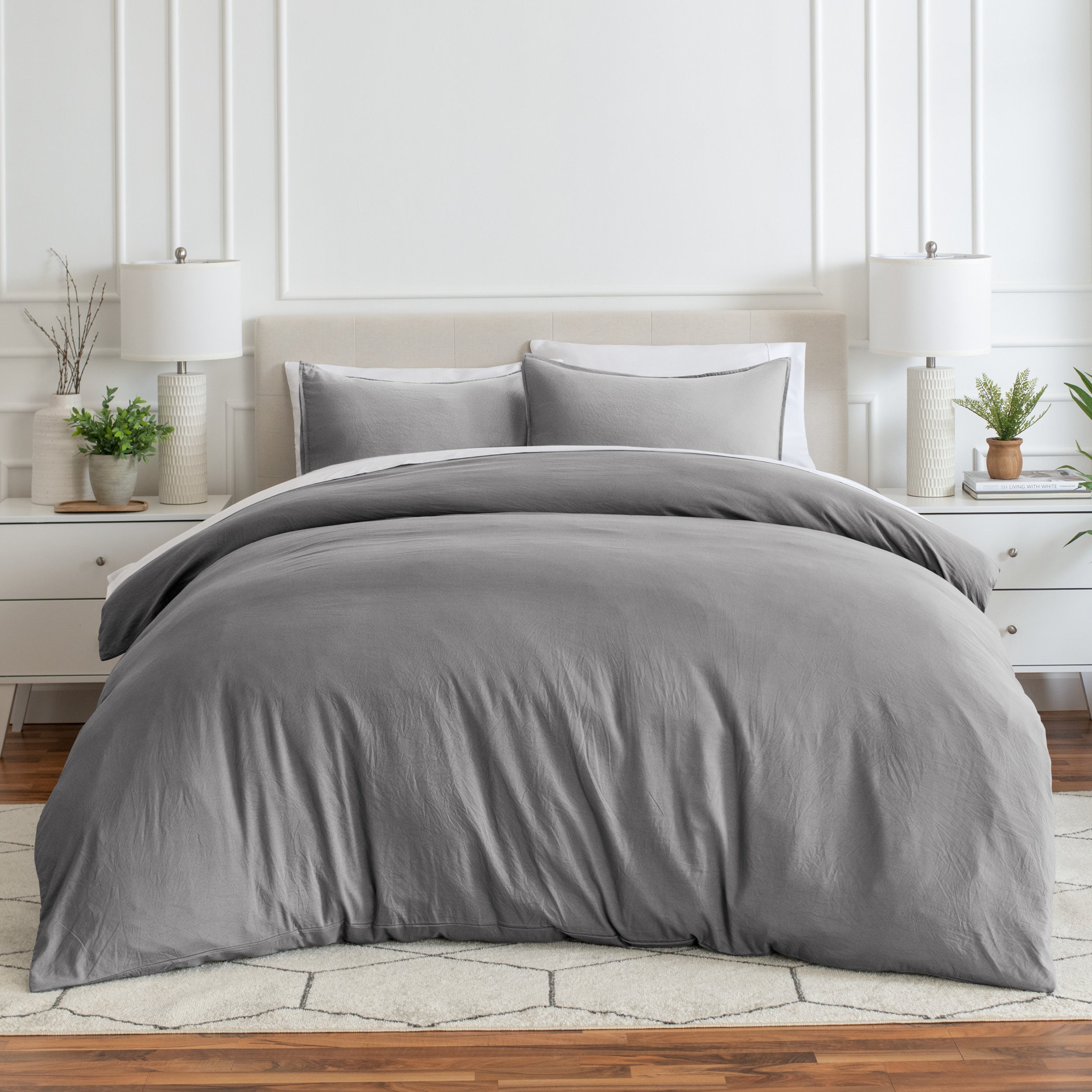 Relaxing room scene with a duvet cover laid out over the bed