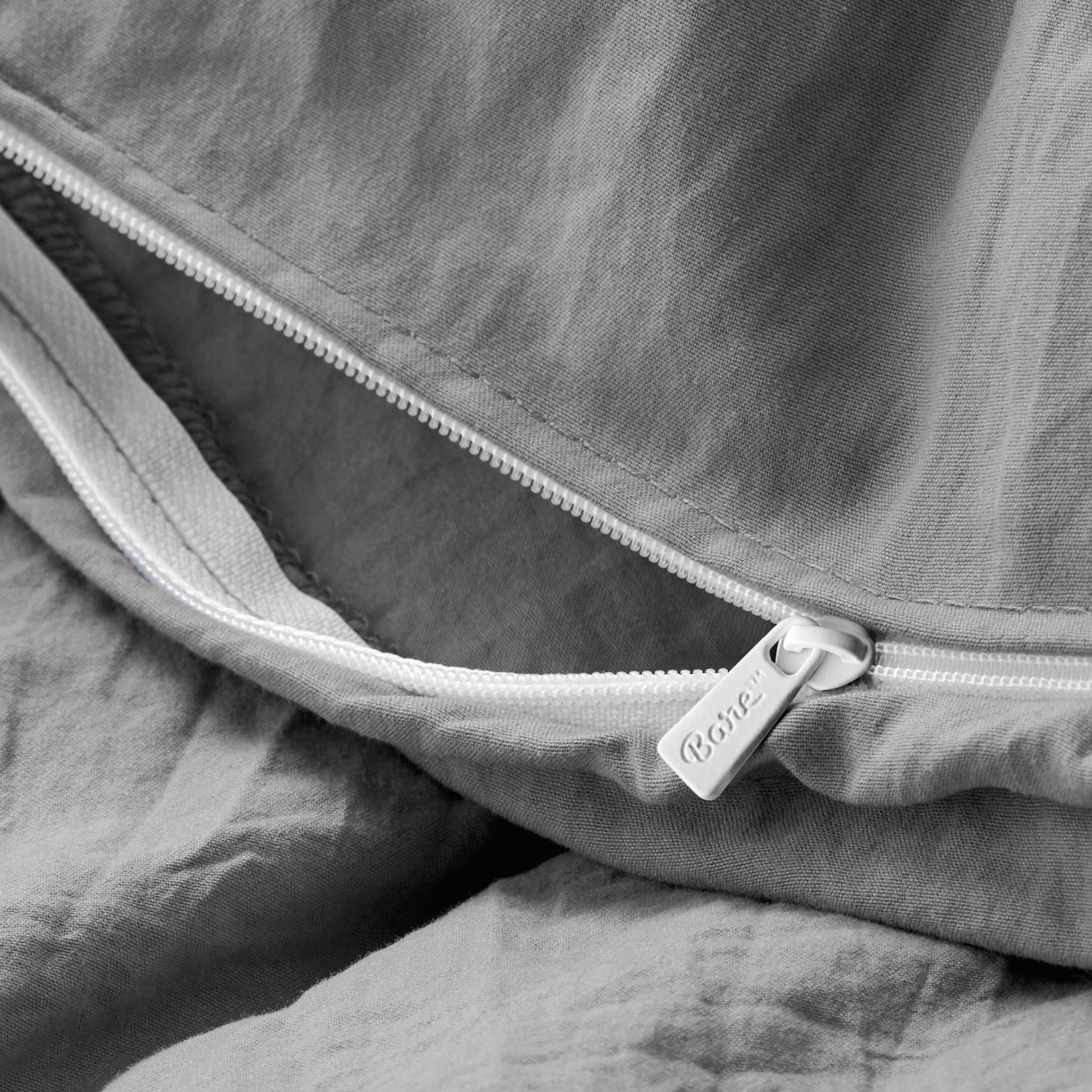 Close up of the zipper on the duvet cover partially opened