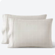 Two pillowcases on a white background with print pillowcases on them.