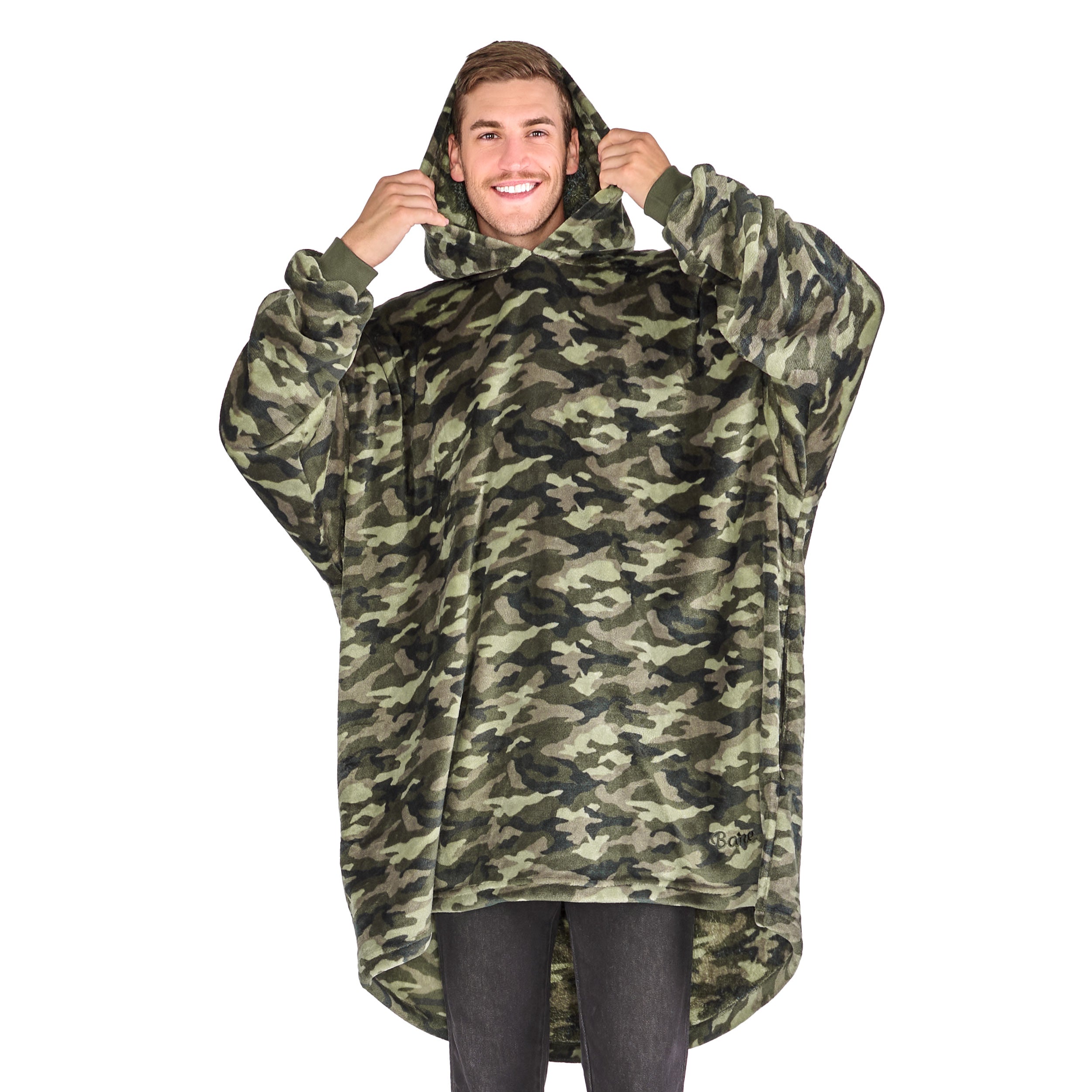 A man standing with a wearable blanket on