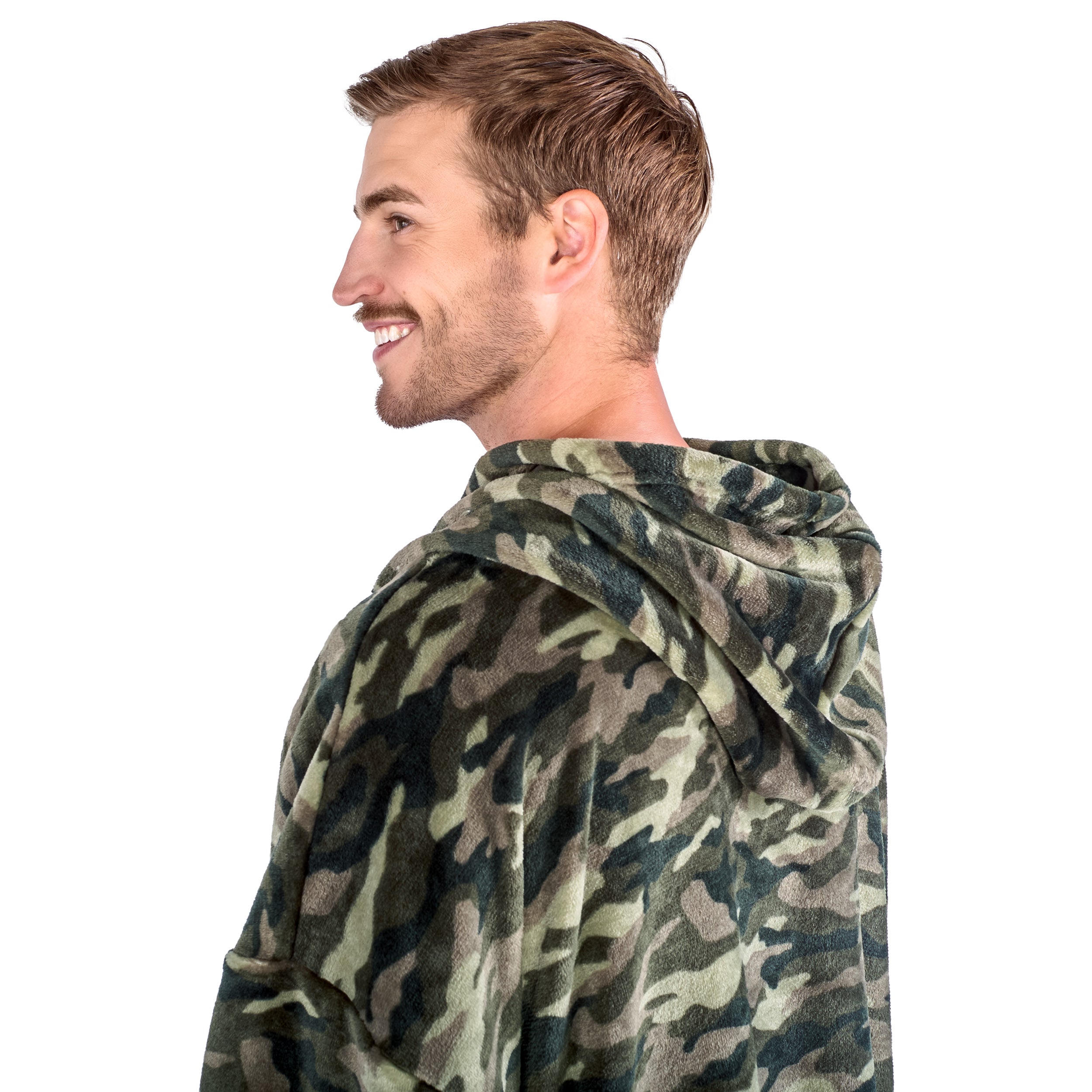 A man has a hooded microplush wearable blanket on