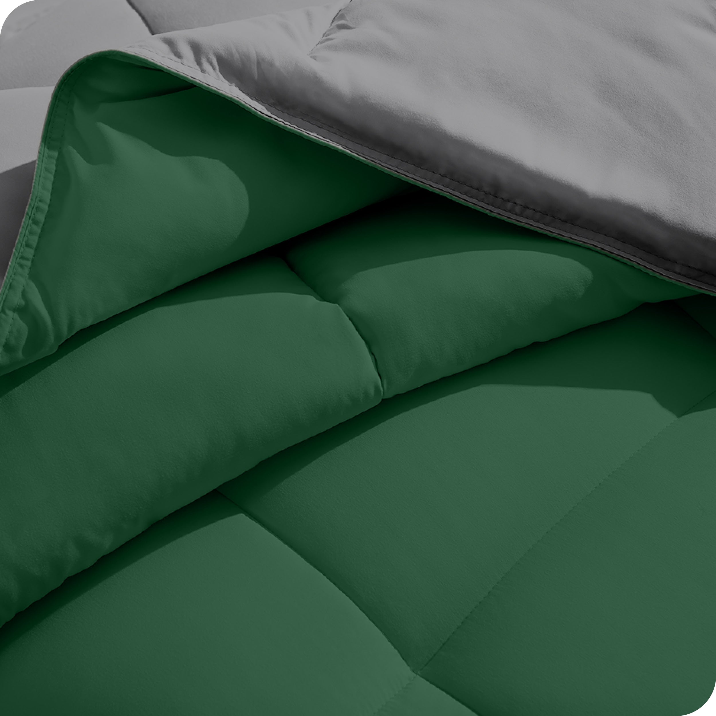 Close up of the comforter folded back showing the two different colored sides.