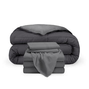 A reversible microfiber comforter and a coordinating sheet set folded and stacked 