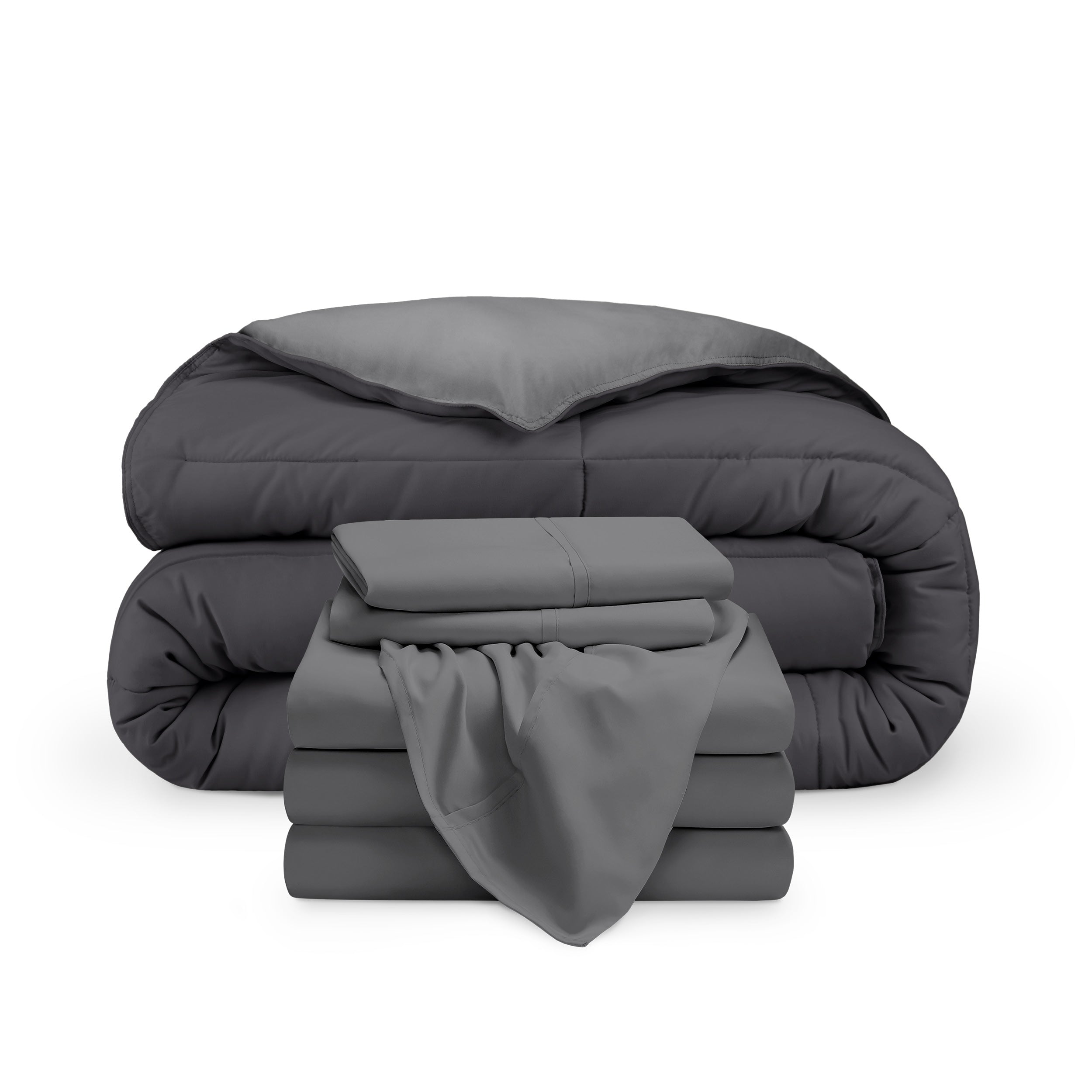 A reversible microfiber comforter and a coordinating sheet set folded and stacked 