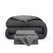 A reversible microfiber comforter and a coordinating sheet set folded and stacked 