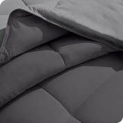 Close up of the comforter folded back showing the two different colored sides.