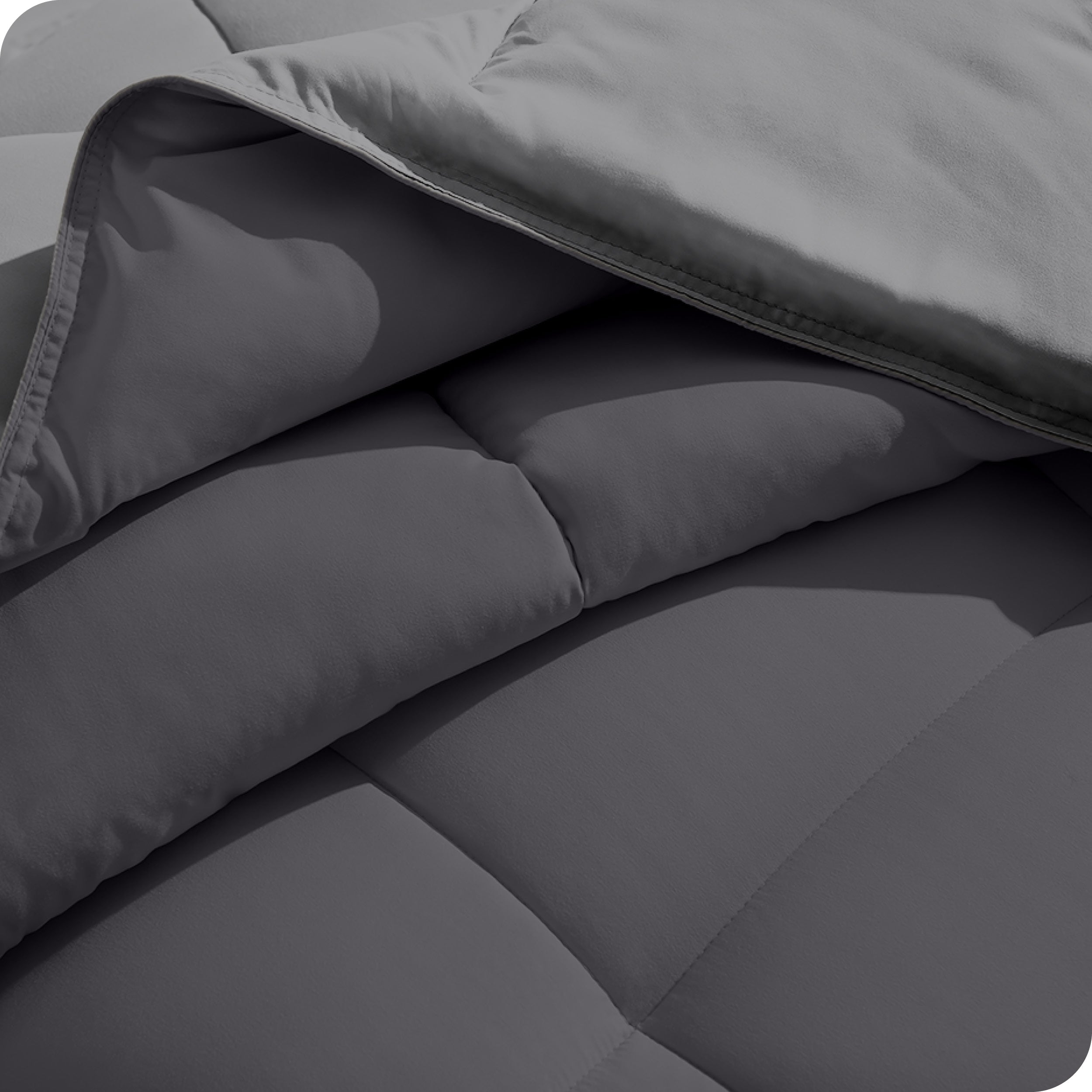 Close up of the comforter folded back showing the two different colored sides.