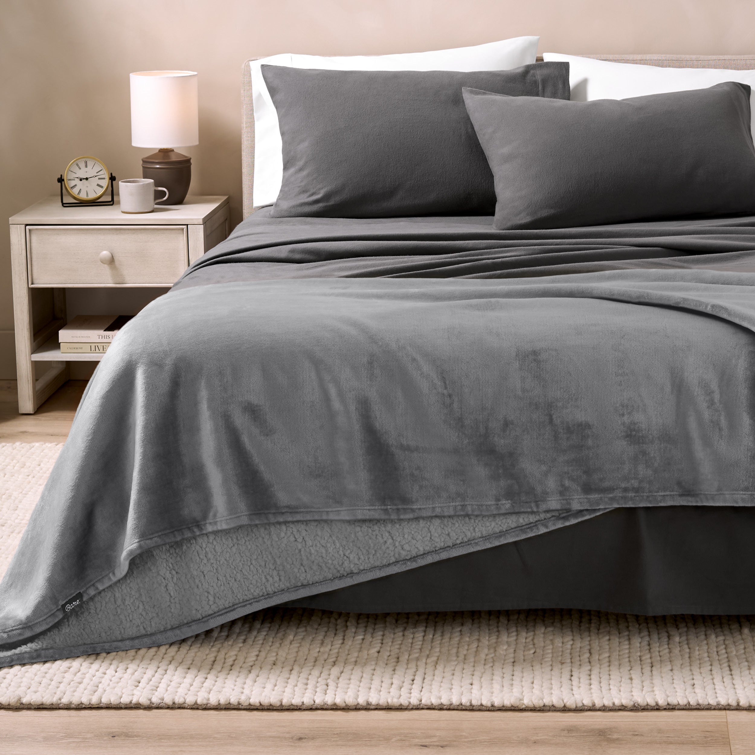 Sherpa Blanket laying on a bed folded over itself part way