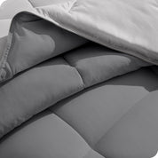 Close up of the comforter folded back showing the two different colored sides.