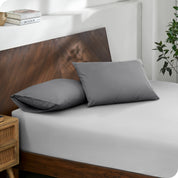 2 pillows with percale pillowcases on a bed
