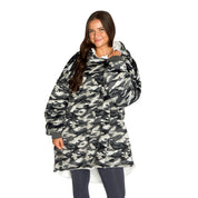 An adult with a sherpa wearable blanket on