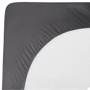 The back of a mattress with a mattress pad on it