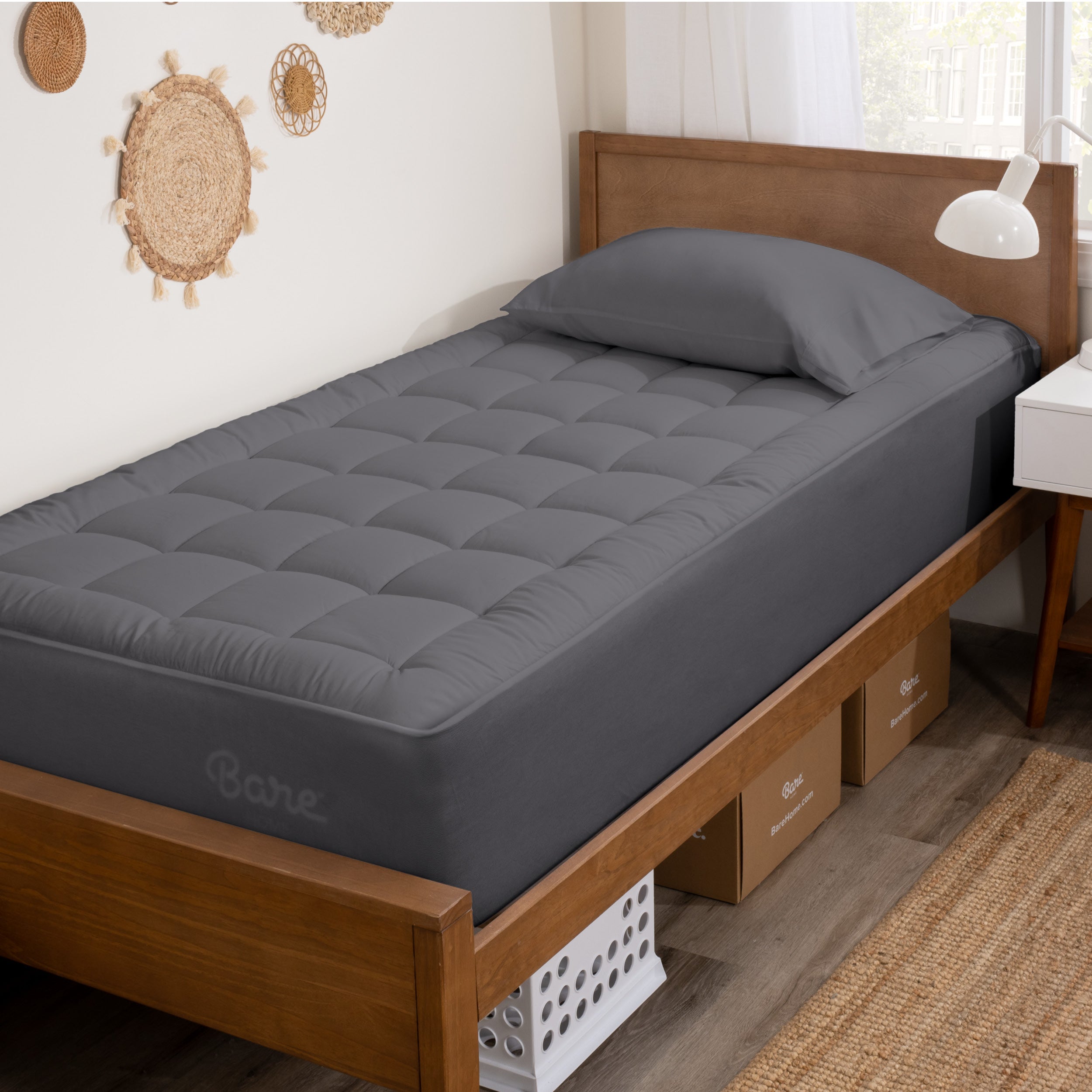 A mattress pad on a bed.