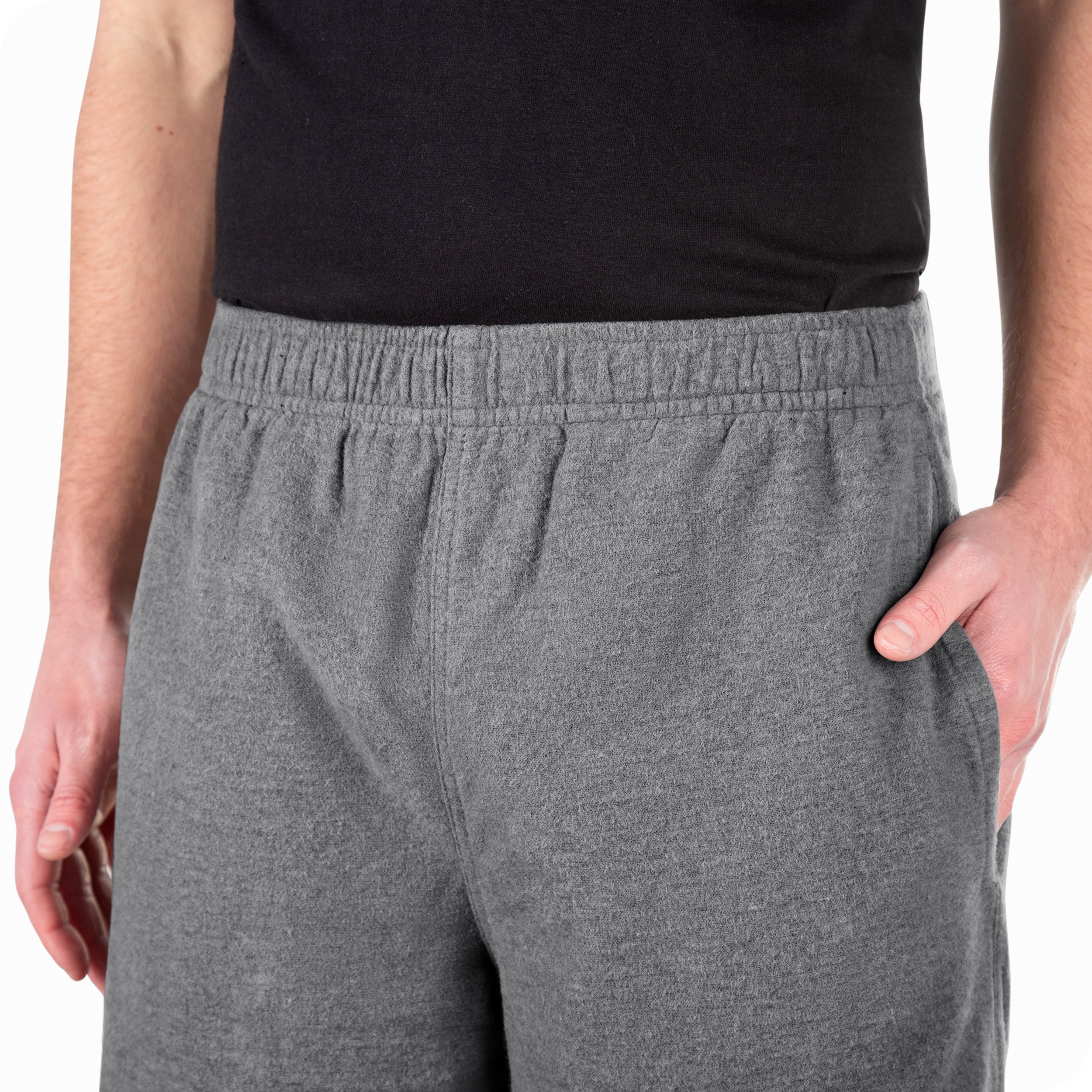 Close-up view of a man wearing flannel pajamas. Highlighting the elastic waistband for a comfortable fit.