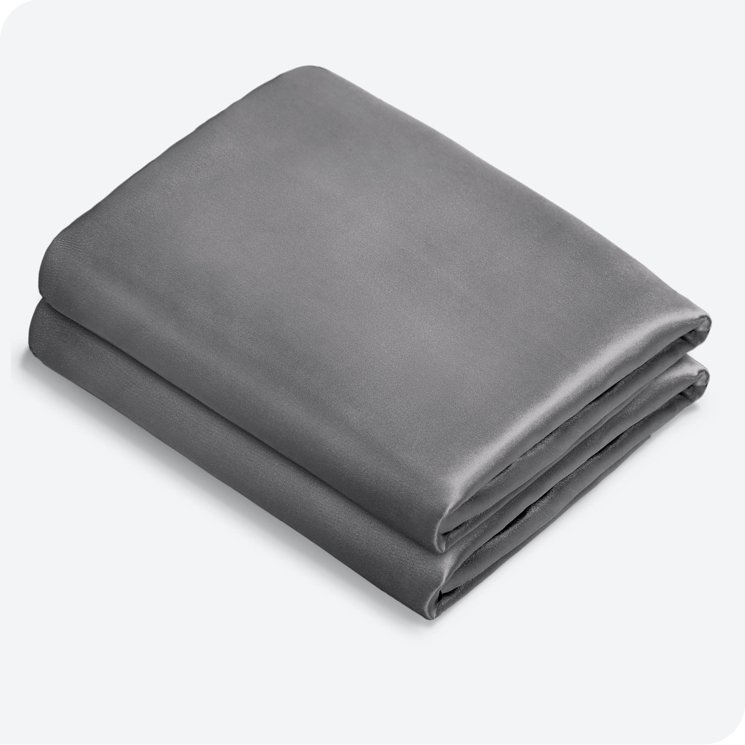 Two silk pillowcases folded and stacked neatly