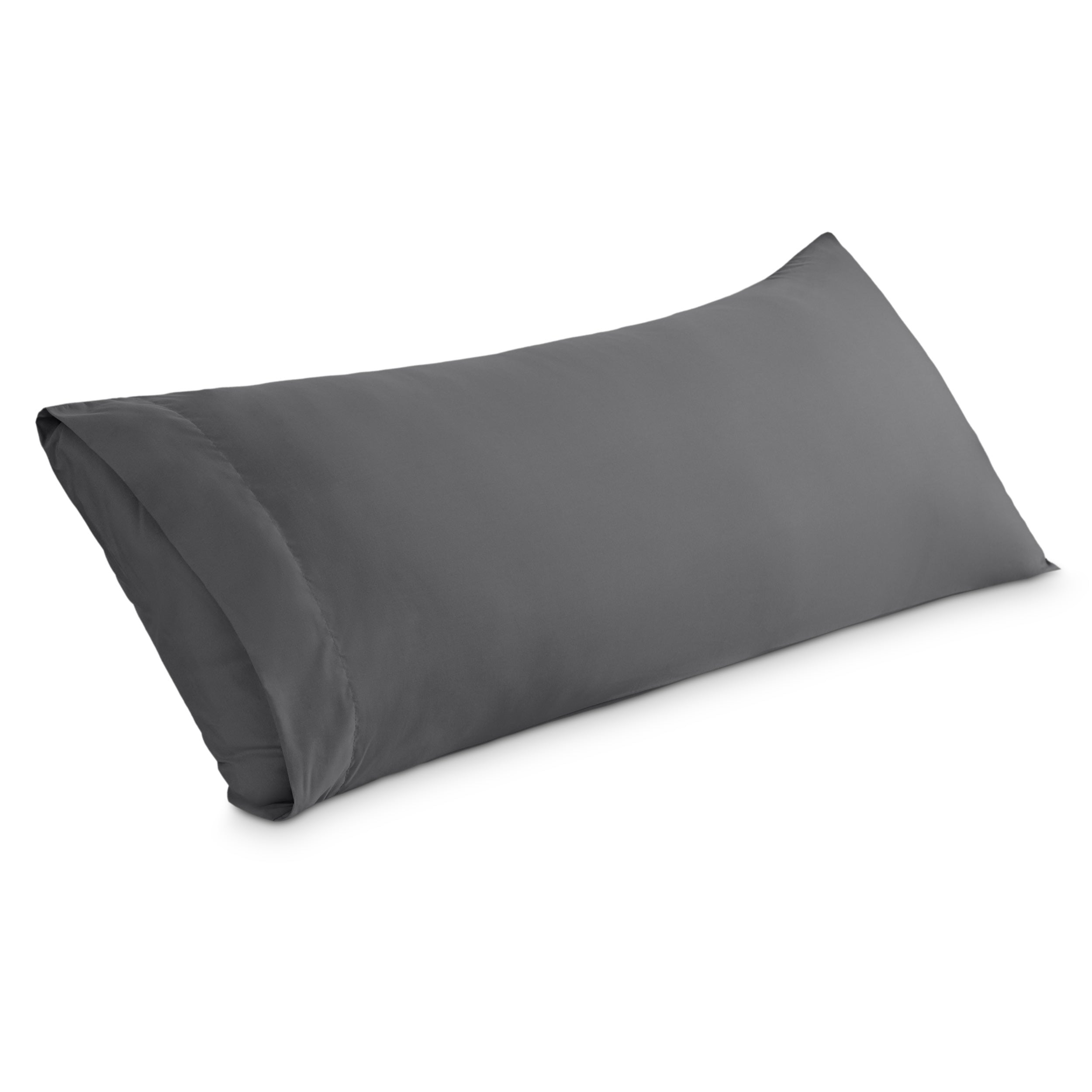 A body pillowcase on a pillow set against a headboard