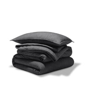 A comforter folded with a matching pillow sham stacked on top