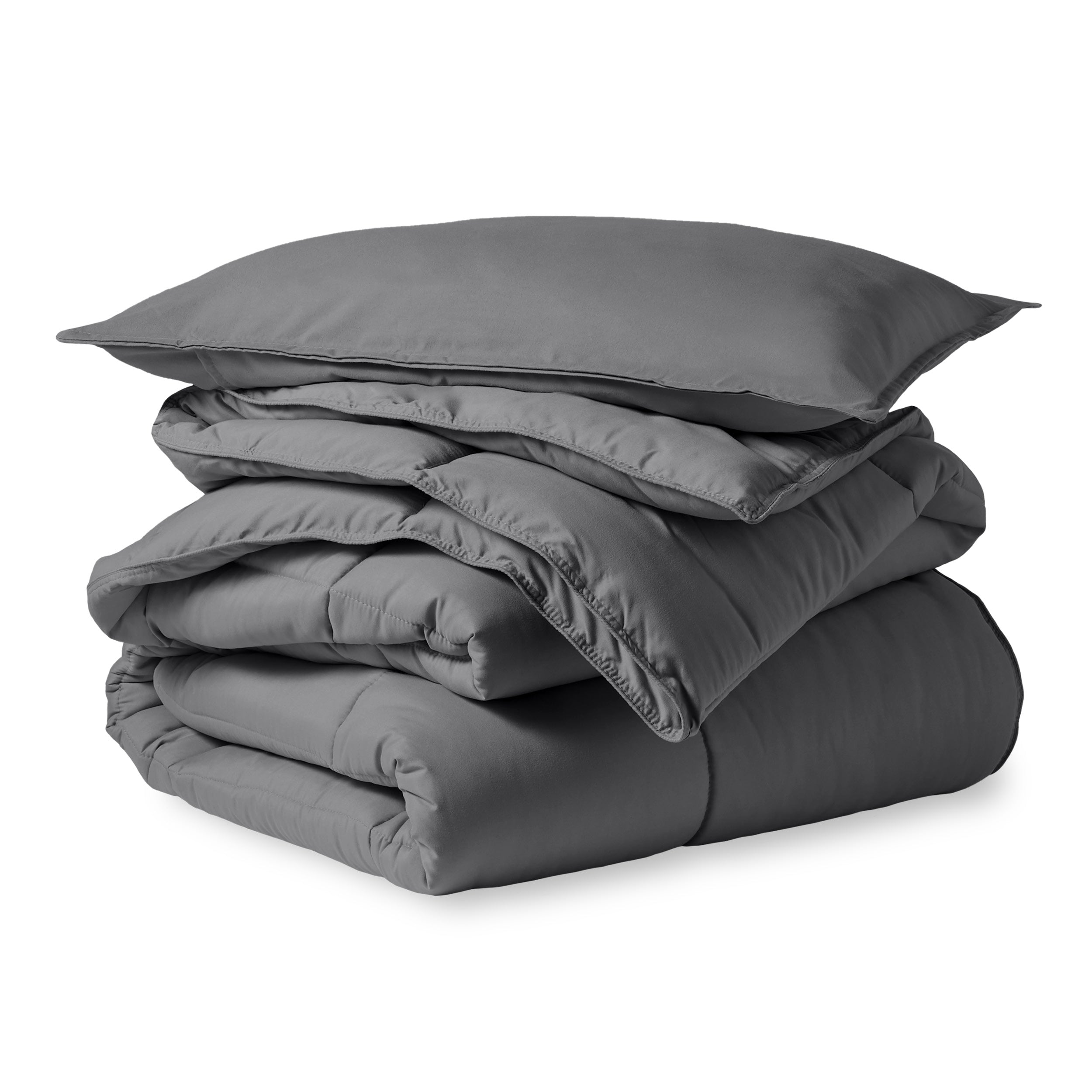 A microfiber comforter folded neatly with a pillow from above