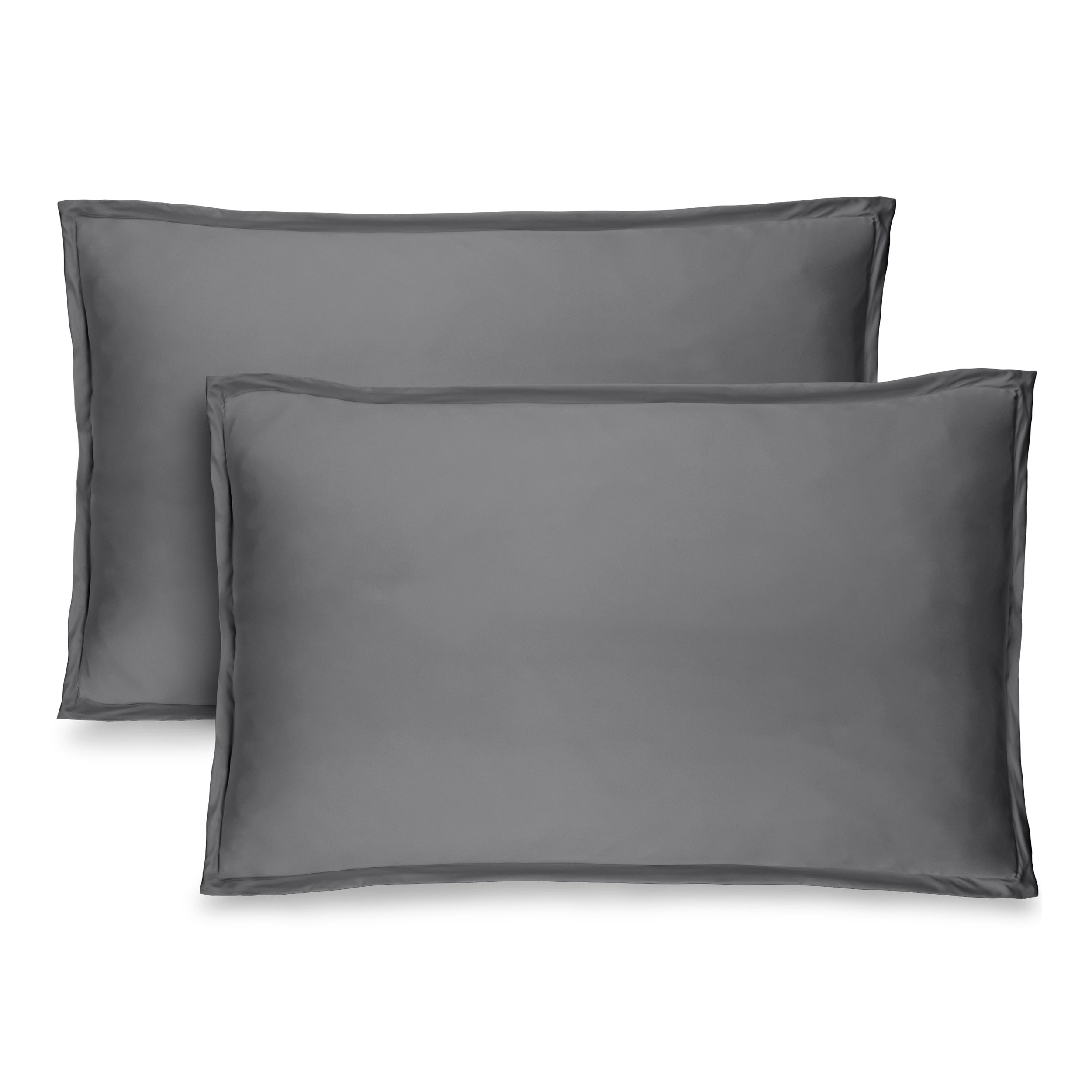 Two pillow shams on pillows standing up with one behind the other