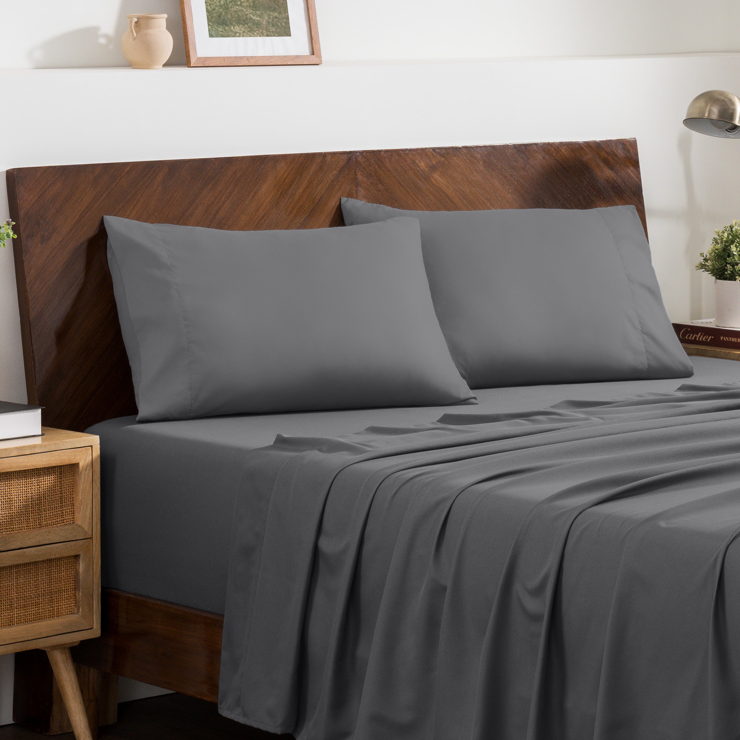 2 pillowcases on pillows on a nicely made bed