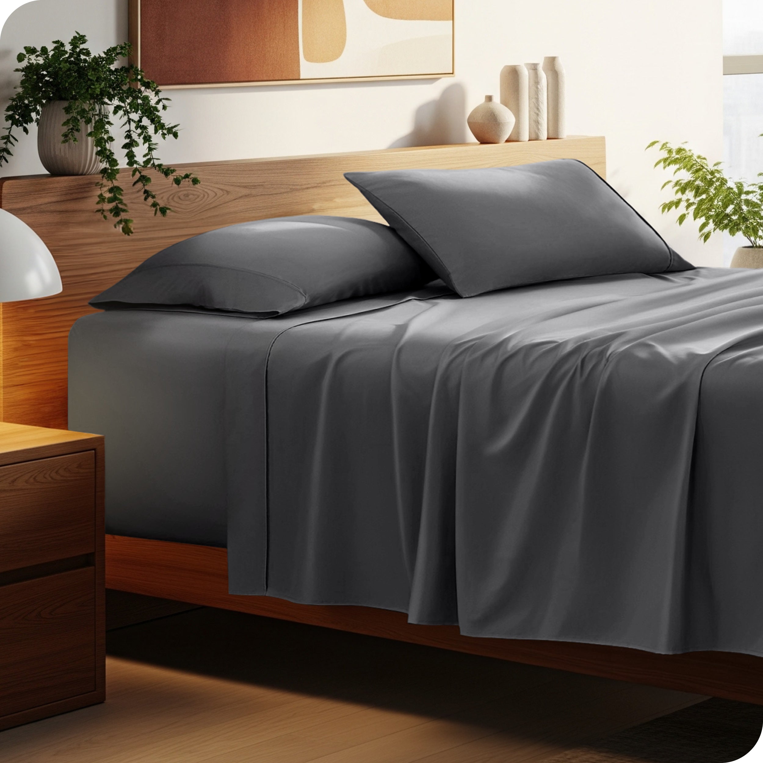 A cozy bedroom featuring a neatly made bed with soft, microfiber sheets