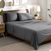 A stretch knit microfiber sheet set on a bed