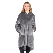 An adult with microplush wearable blanket on