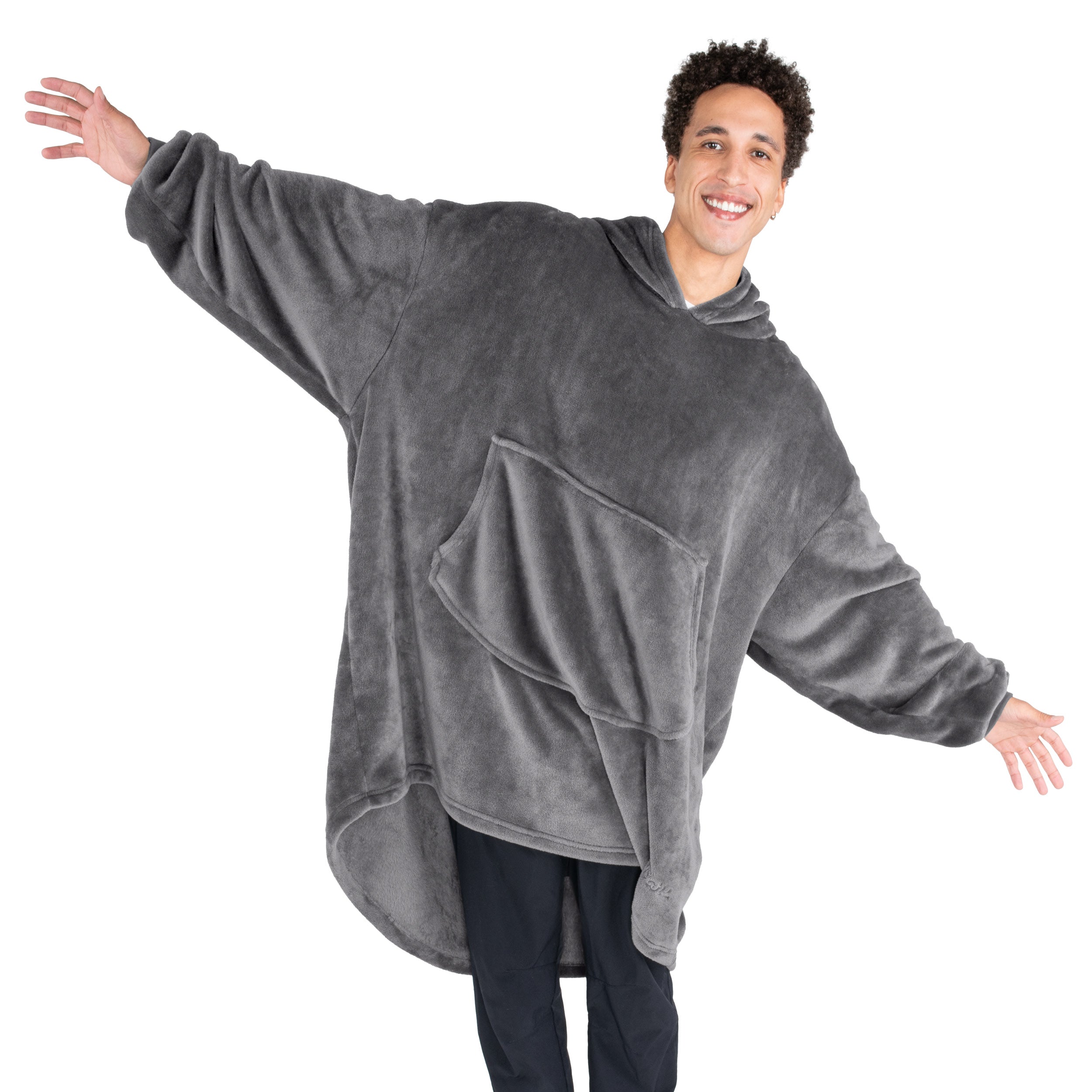 An adult with microplush wearable blanket on