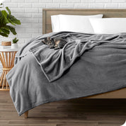 Microplush blanket laid out over a bed and folded back over itself