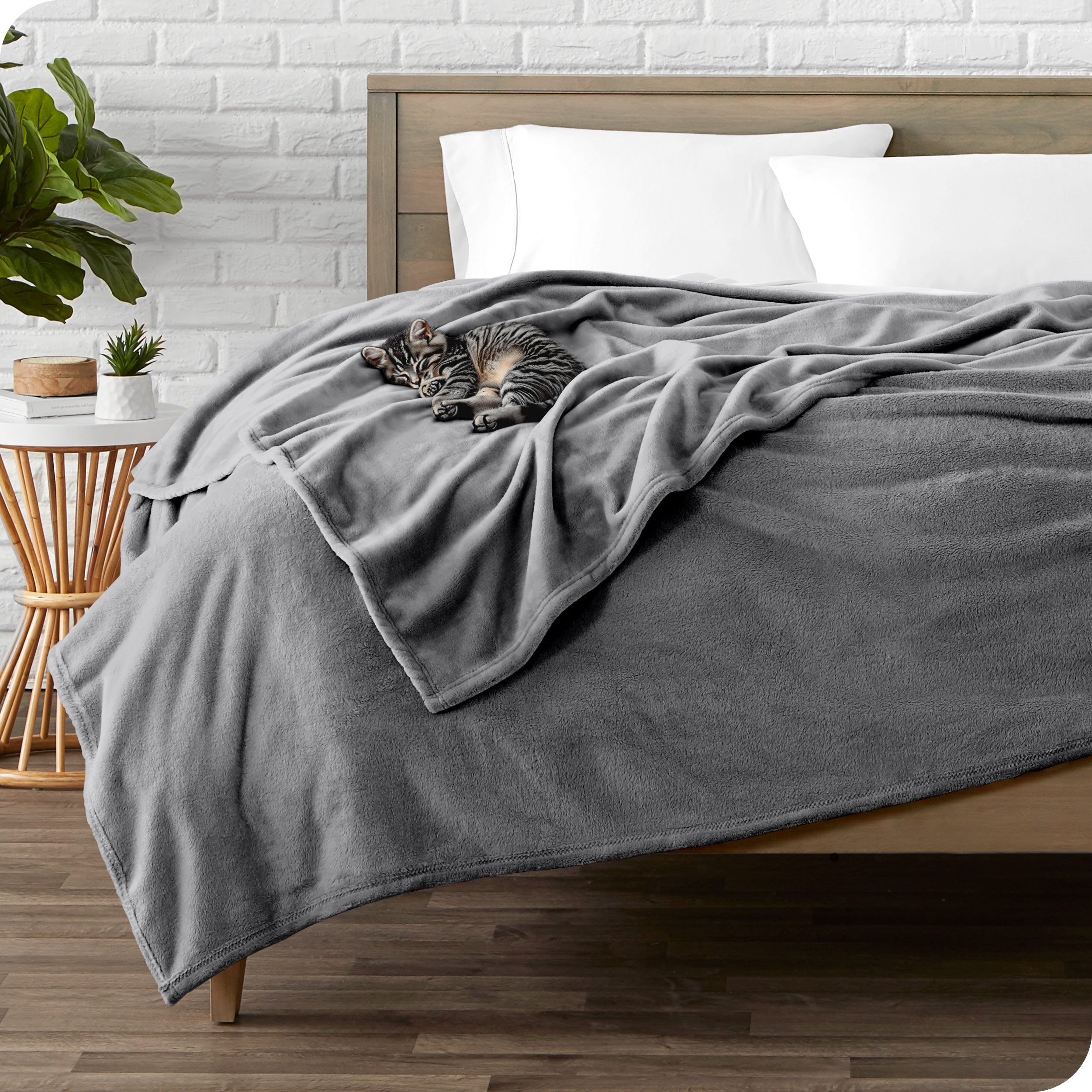Microplush blanket laid out over a bed and folded back over itself