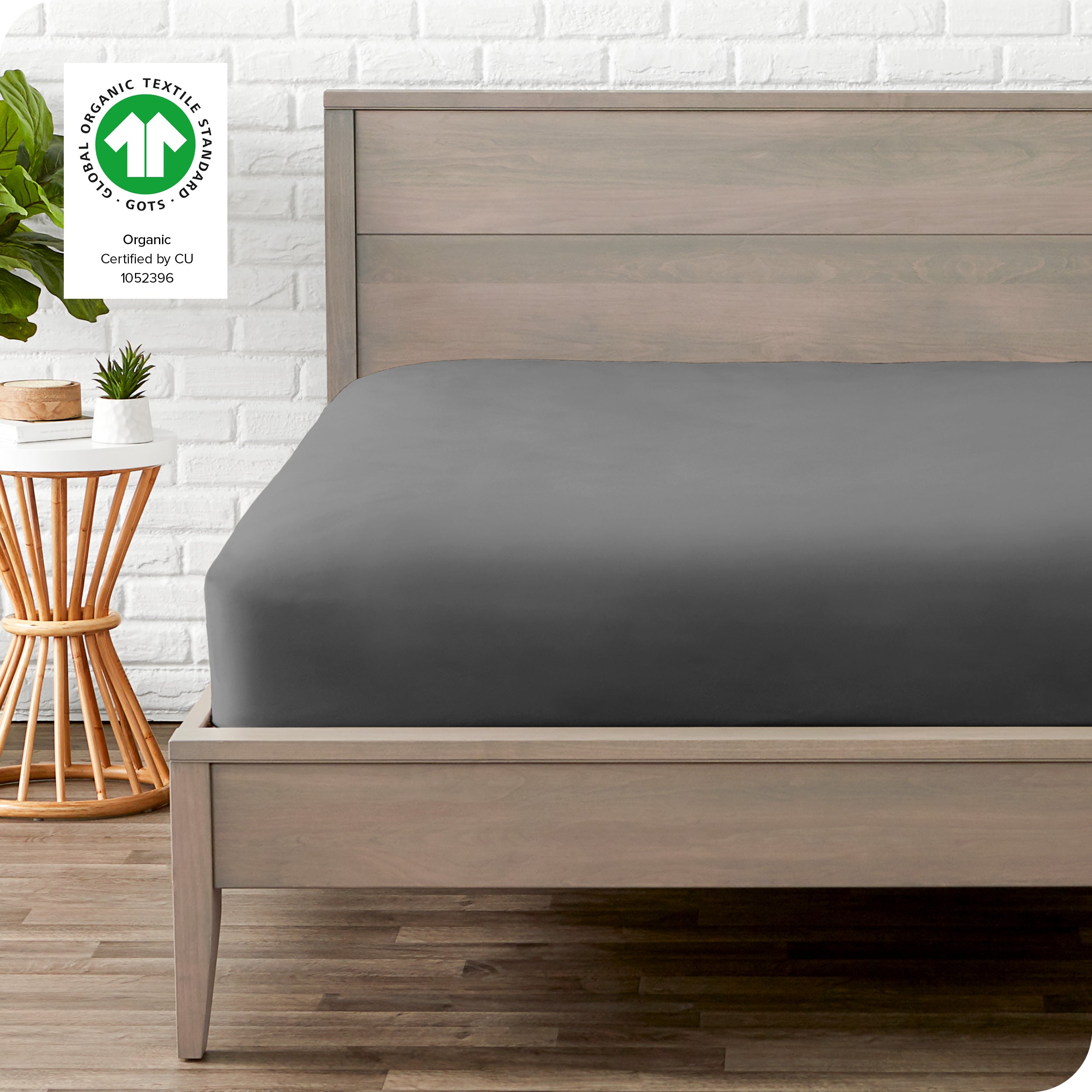 An organic percale bottom sheet on a mattress