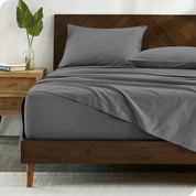 Percale sheets on bed in a modern bedroom