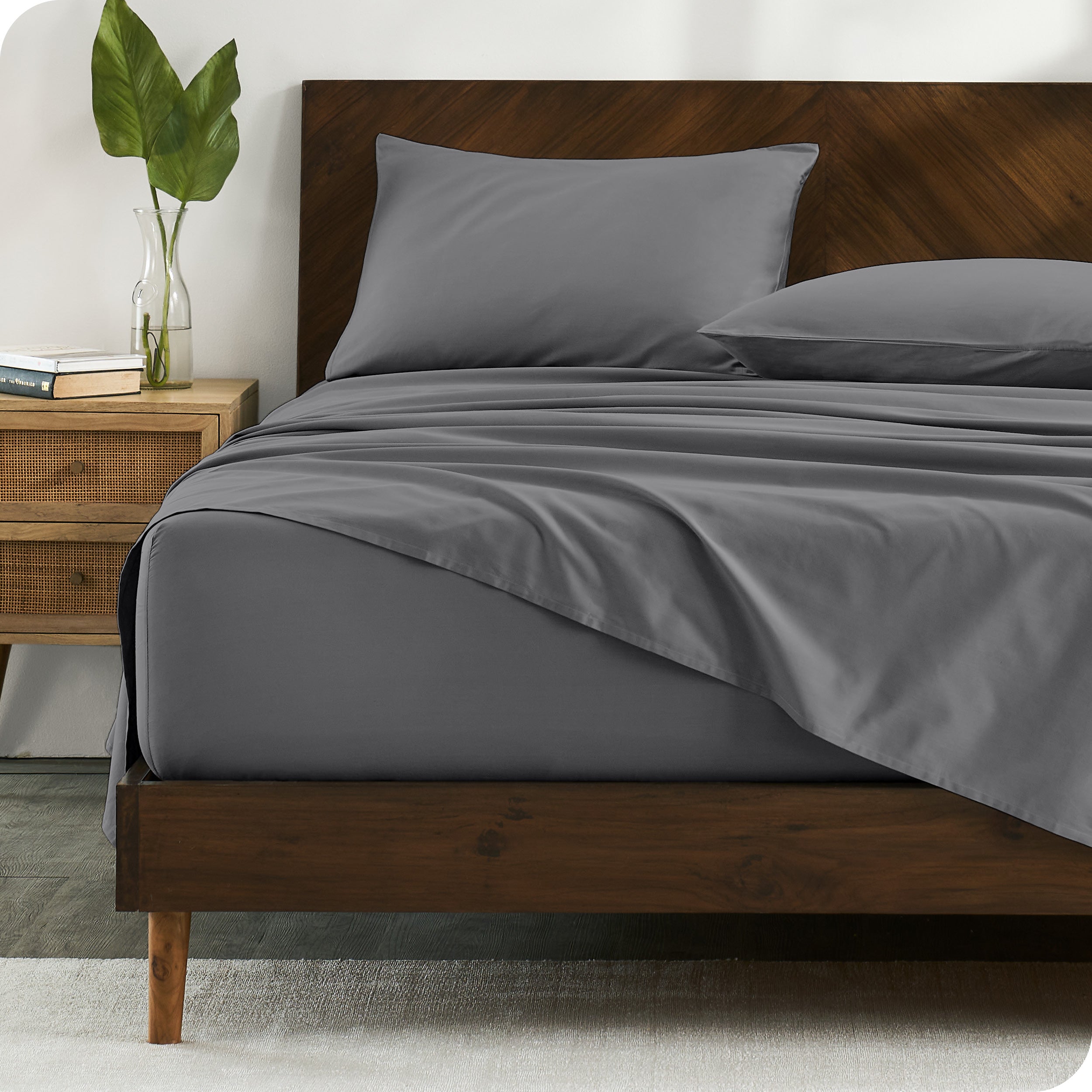 Percale sheets on bed in a modern bedroom