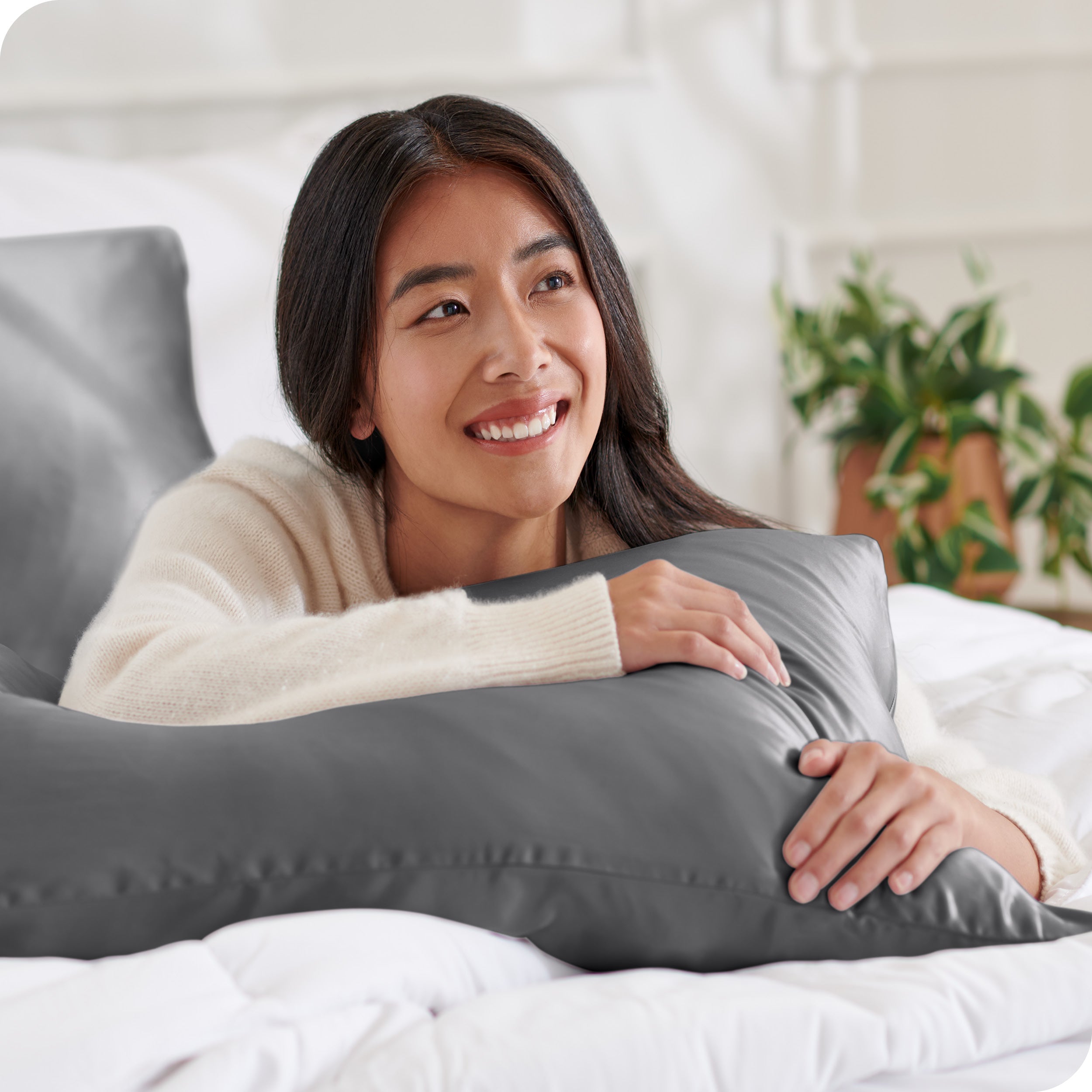 A woman resting her arm on a pillow