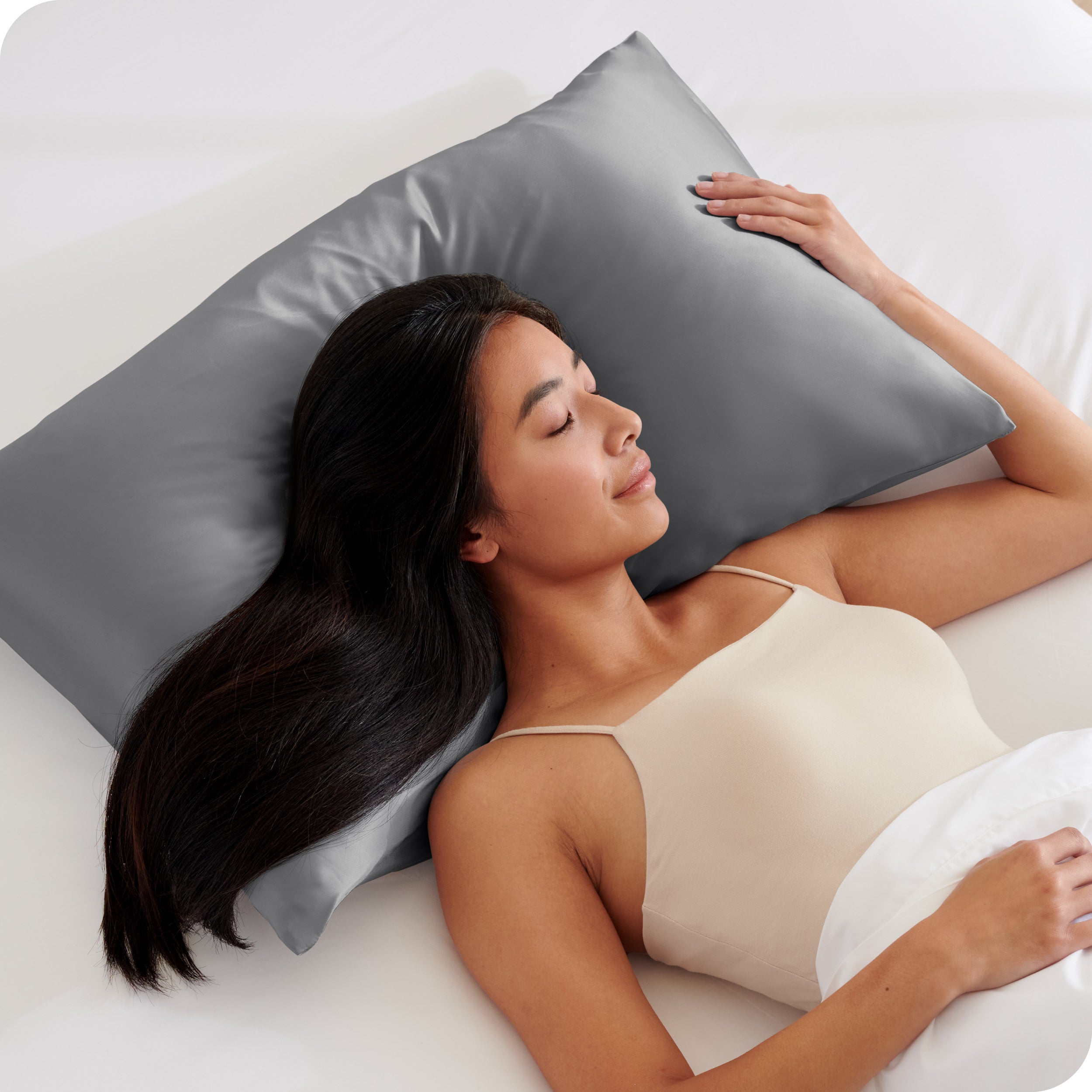A woman sleeping on a silk pillowcase