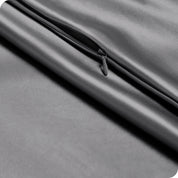 Zipper on a satin pillowcase