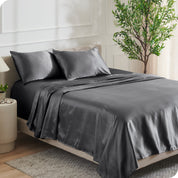 Satin sheets on a bed