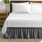 A wrap around bed skirt on a bed