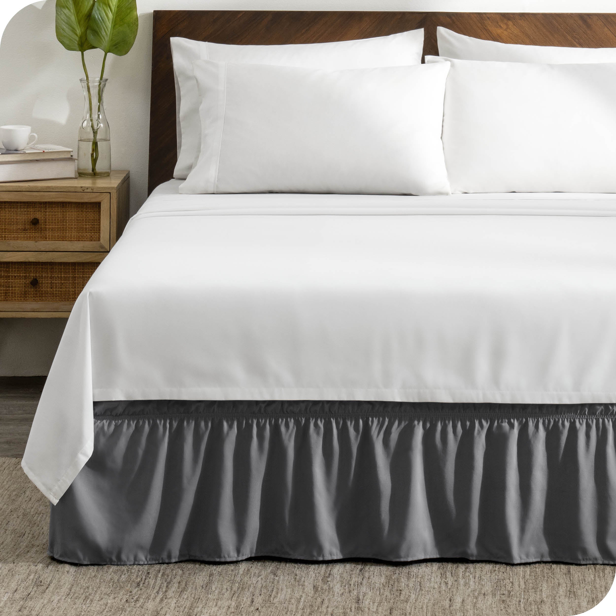 A wrap around bed skirt on a bed