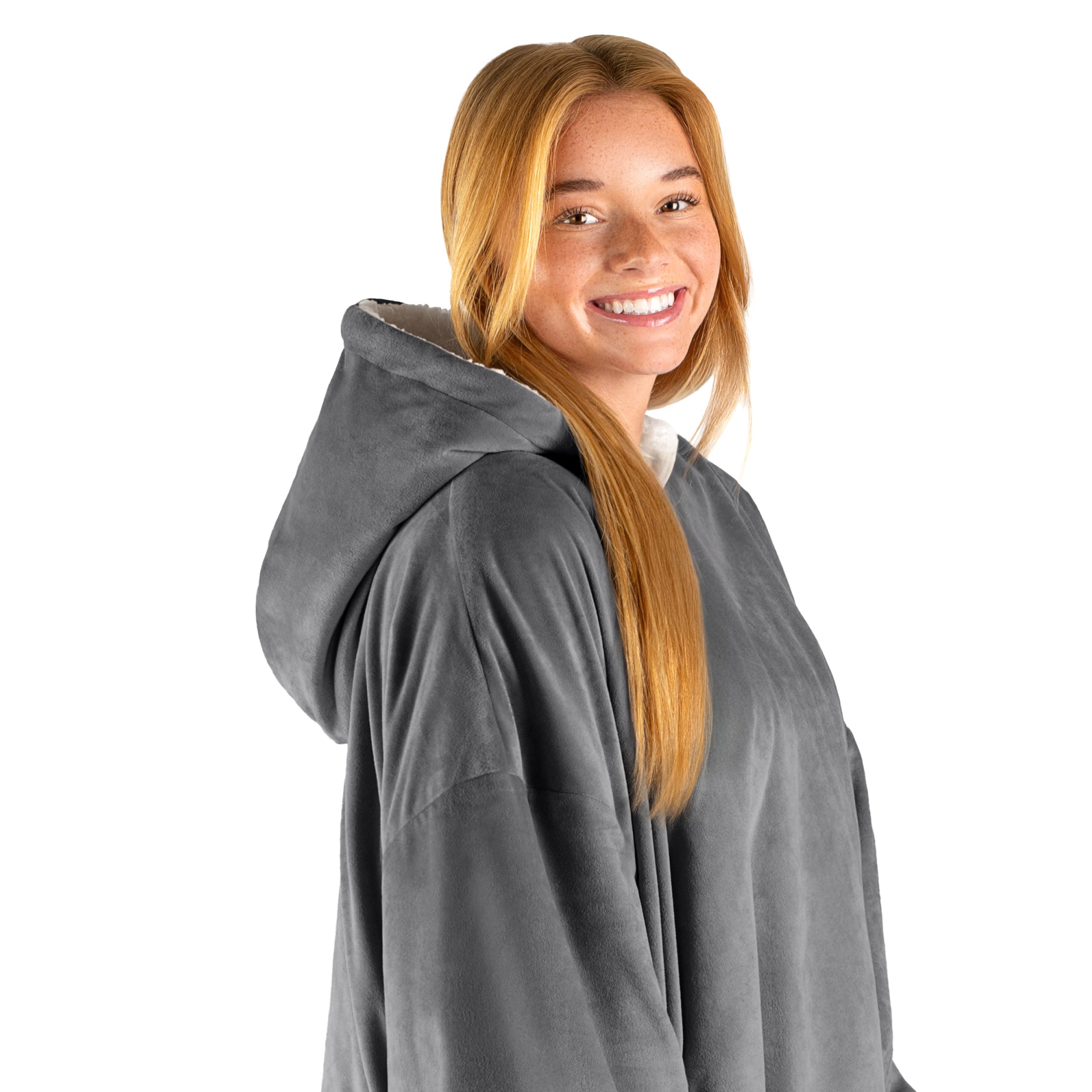 An adult with a hooded wearable blanket on
