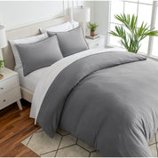 Angled view of bed with a duvet cover folded over on itself