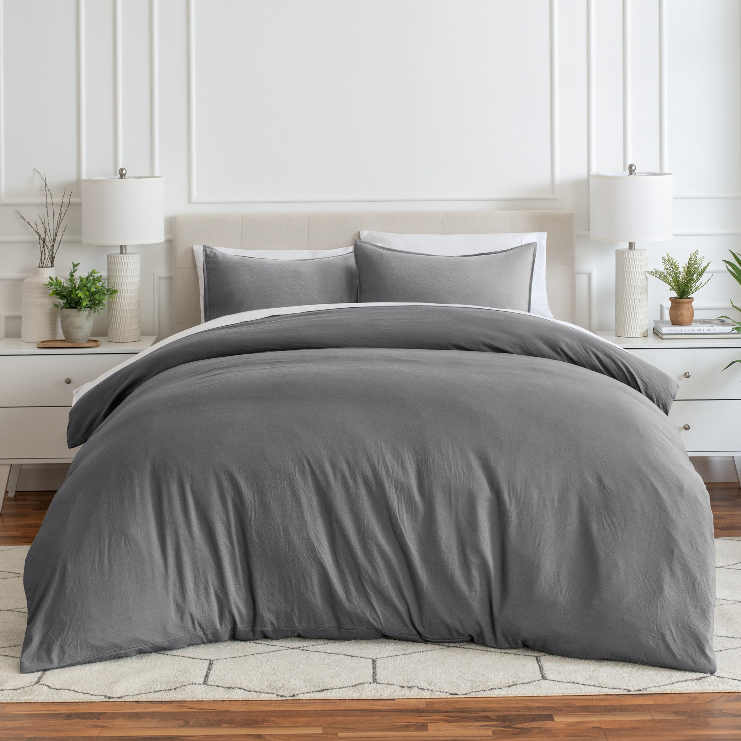 Relaxing room scene with a duvet cover laid out over the bed