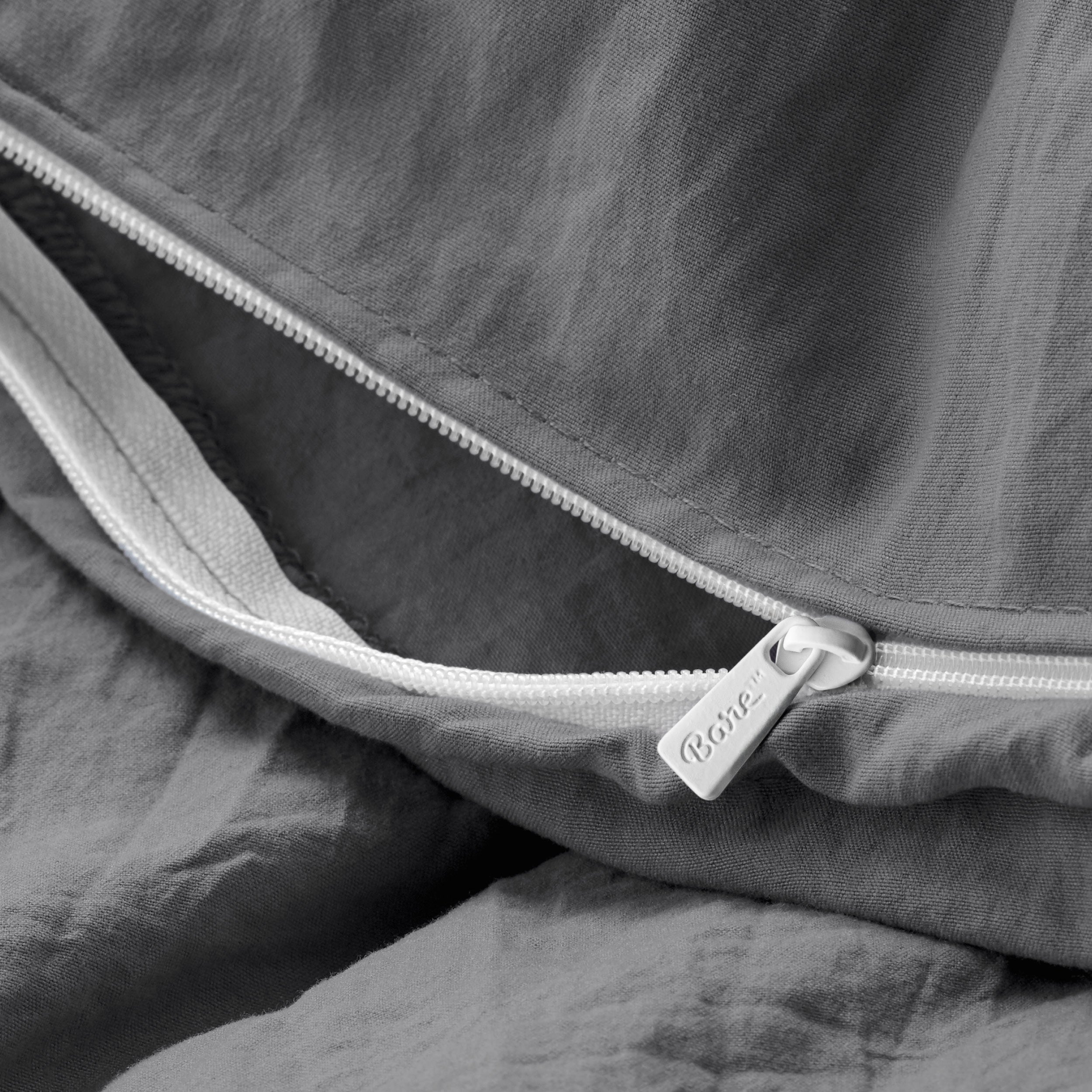 Close up of the zipper on the duvet cover partially opened