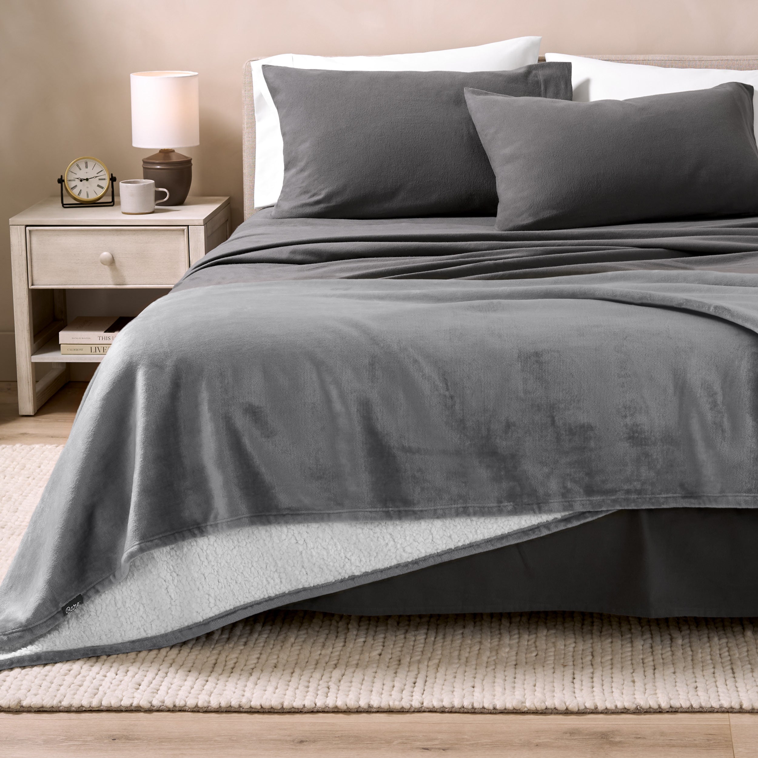 Sherpa Blanket laying on a bed folded over itself part way