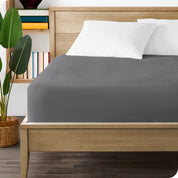 A bed made with a mattress protector