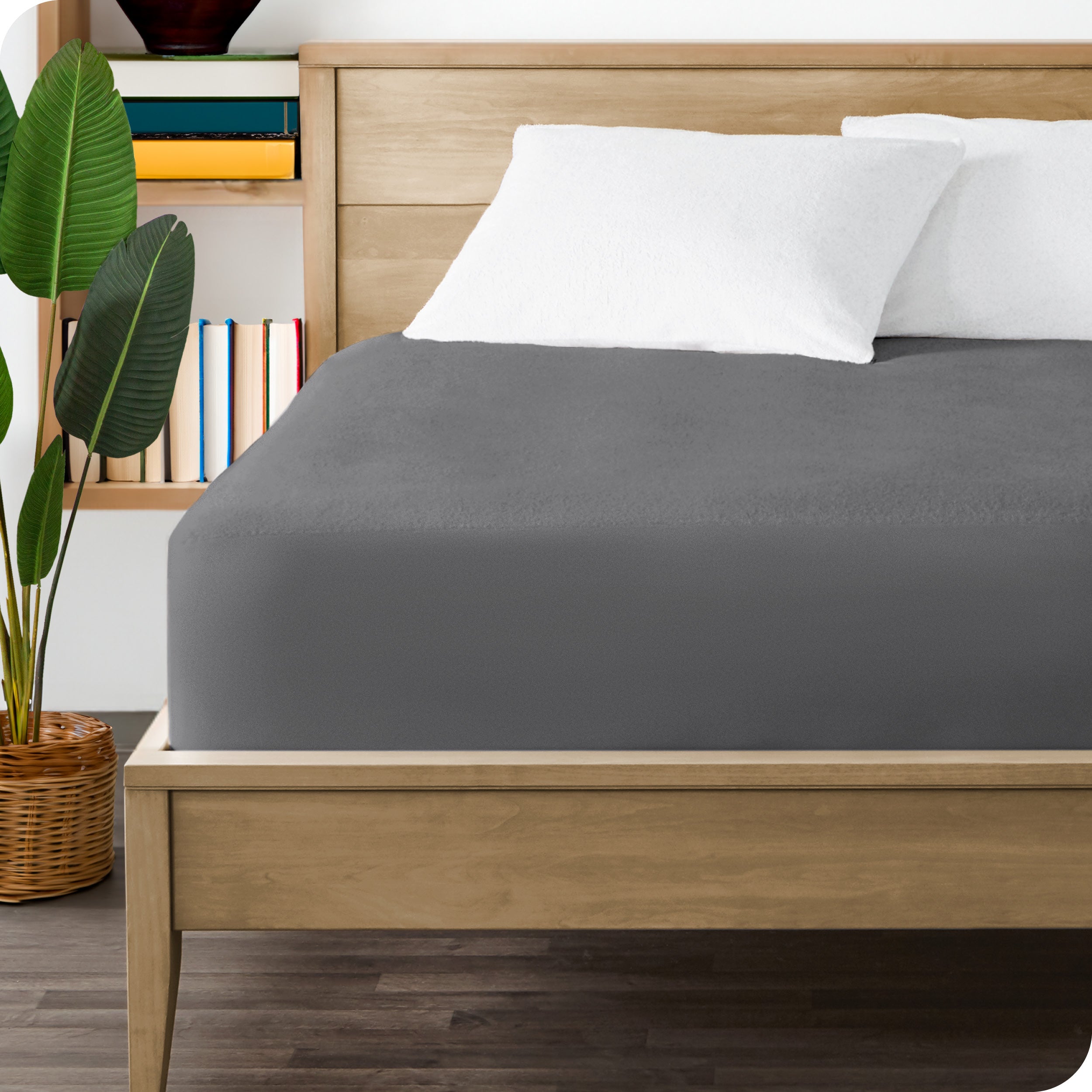 A bed made with a mattress protector