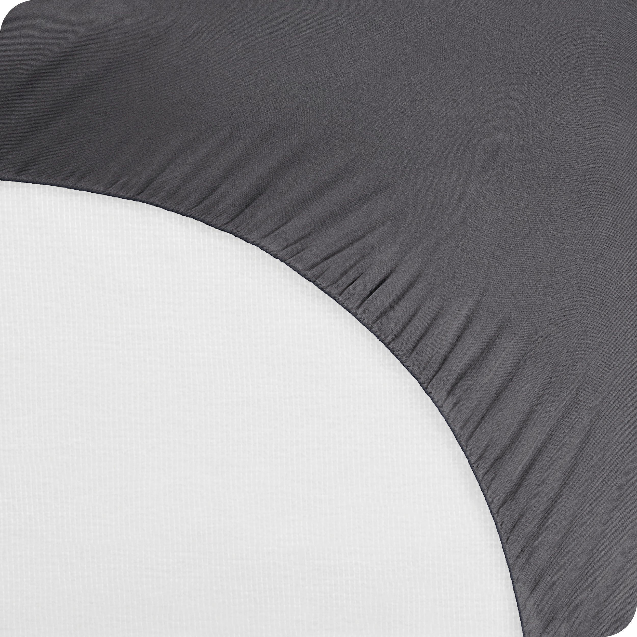 The bottom of a mattress protector on a mattress